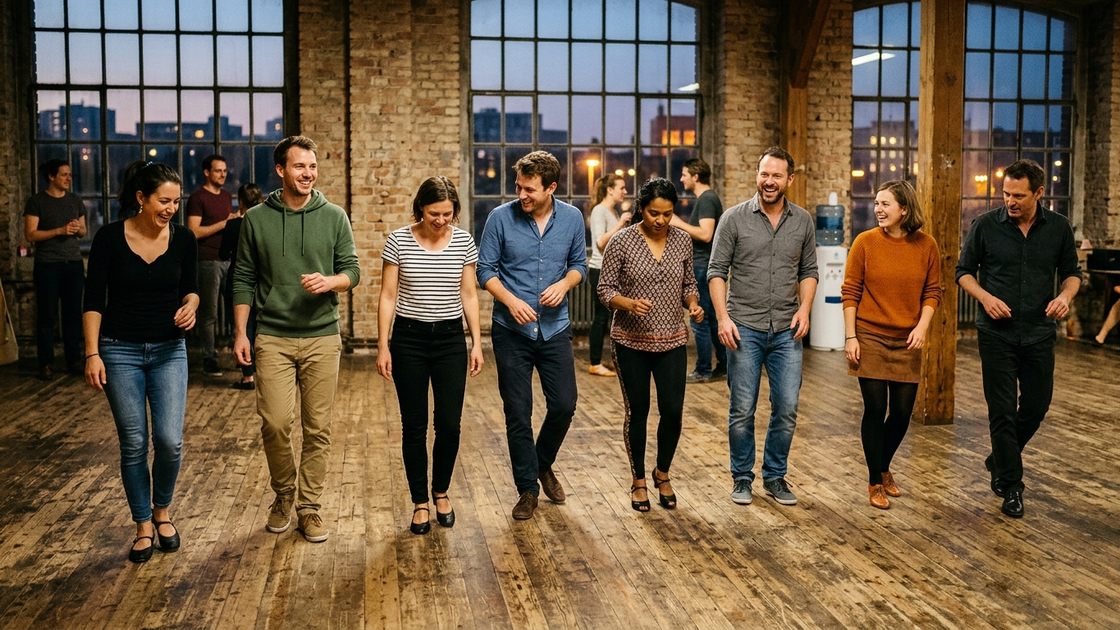 Dance classes in Berlin: eight beginners in a loose line, mid-step, in a converted-loft studio at dusk