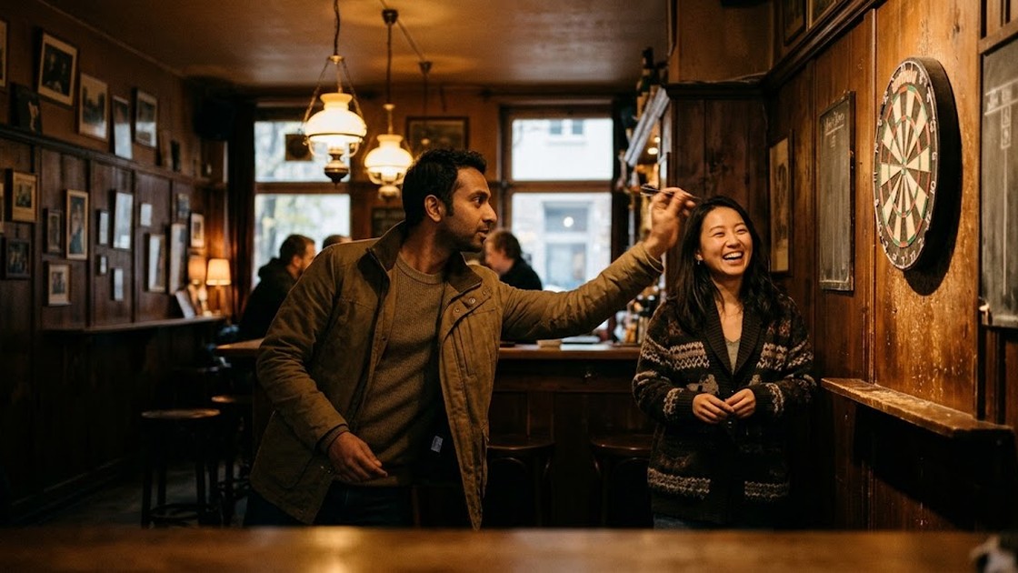 Darts in Berlin: two friends laugh in a wood-panelled bar as one of them throws at the dart board